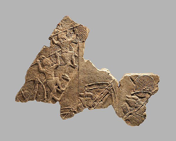 Fragment of an Assyrian palace relief showing a siege.