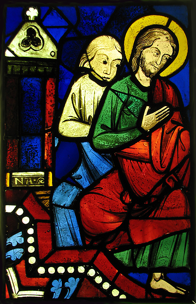 Two seated apostles in a medieval stained-glass fragment.